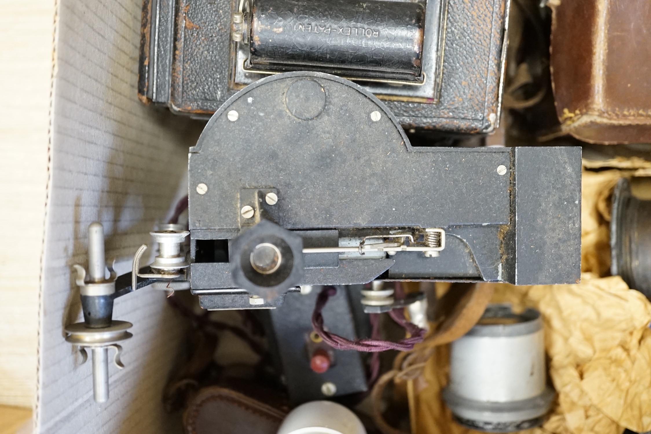 An Ensign Popular large format reflex camera, two cine cameras, projector, lenses etc.